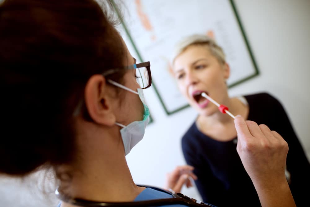 shutterstock_769567186 woman completing genetic testing