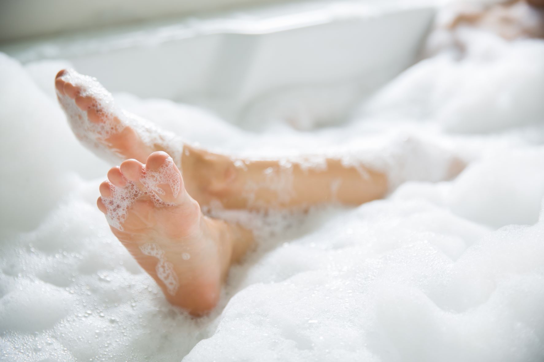 Feet in bubble bath